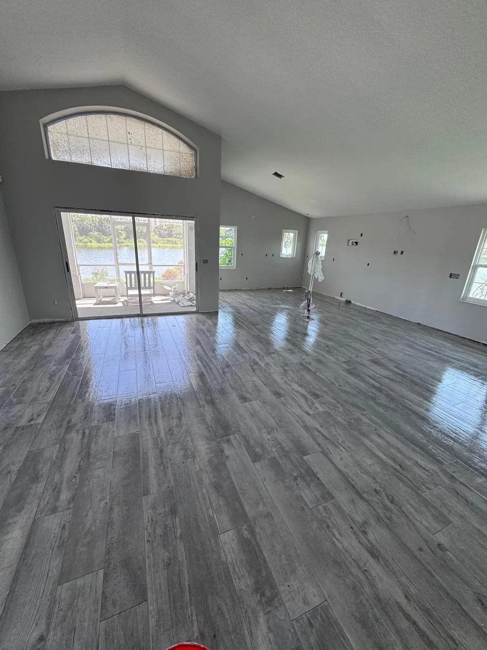 Installed wood-look flooring across an open living room