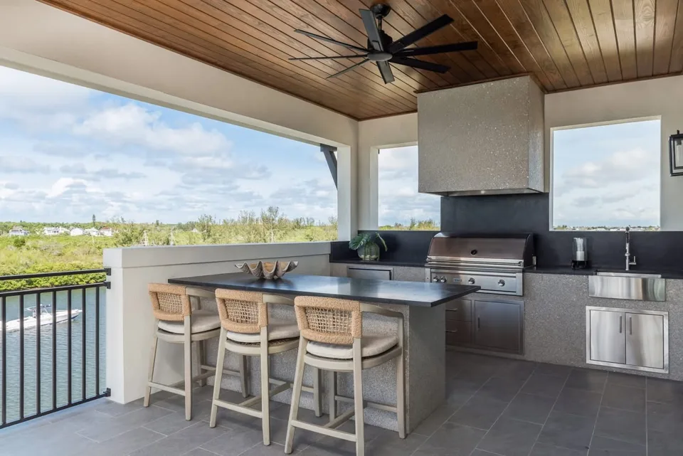 Covered outdoor kitchen overlooking the water